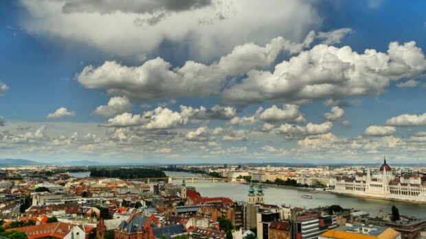 A panoramic view of Budapest cityscape featuring the Danube River and historical landmarks in Hungary