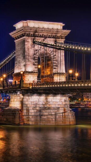 Chain bridge tower architecture at night in Hungary
