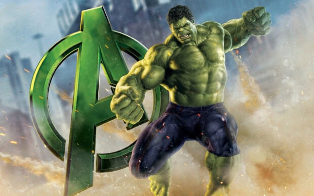 The Incredible Hulk with muscular build and fierce expression in front of Avengers logo