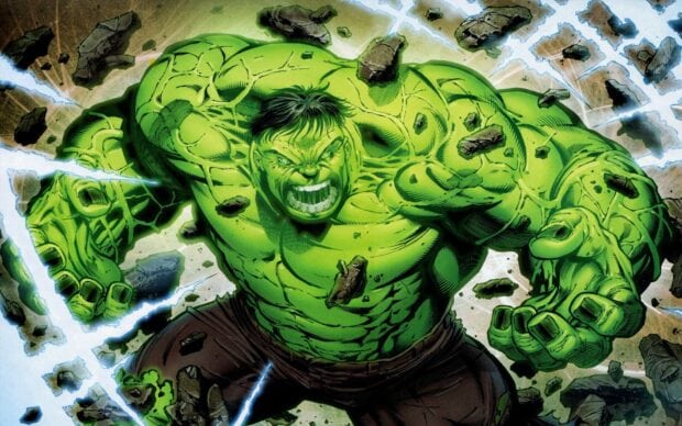 Incredible Hulk showing immense strength with rocks floating around him in an intense scene