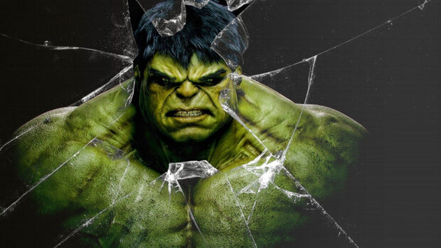 Incredible Hulk character showing strength through broken glass in intense scene