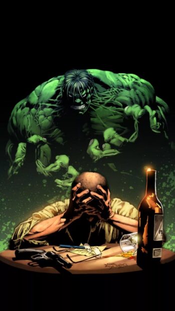 A man overwhelmed with despair sits at a table while the Hulk looms behind him in a dark setting