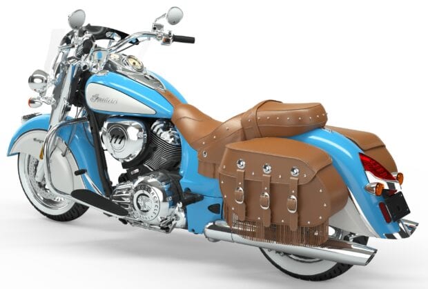 Classic Indian motorcycle with leather saddlebags and blue paint detail in vintage style