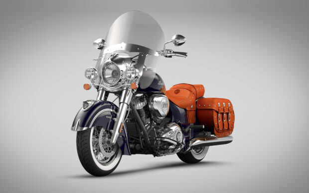 Classic Indian motorcycle with orange leather saddlebags and vintage design