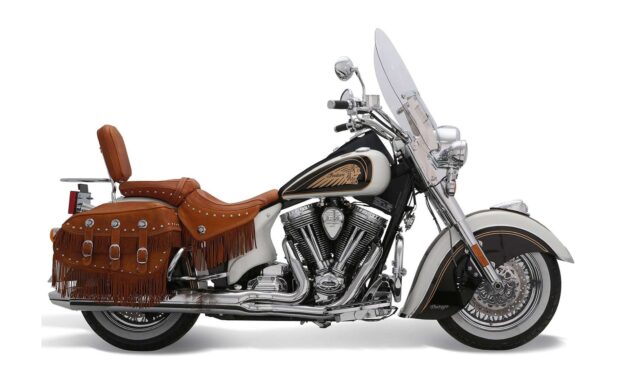 Classic Indian vintage motorcycle with leather fringed saddle bags and detailed engine design