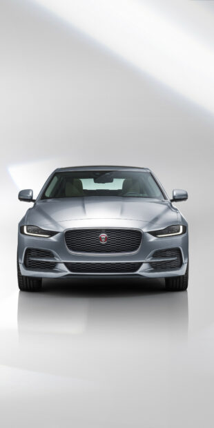 Front view of a silver Jaguar Cars on a white studio background