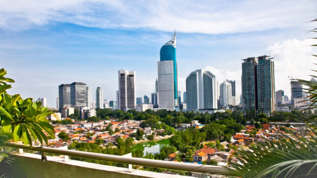 Modern buildings and greenery in Jakarta cityscape with Jakarta river view