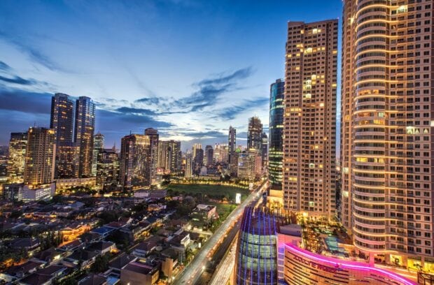 Jakarta city skyline at dusk with skyscrapers and busy roads in high definition