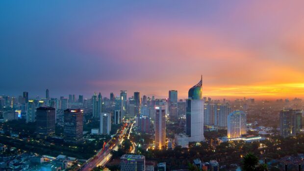Jakarta city skyline at sunset with modern skyscrapers and vibrant lights in HD quality