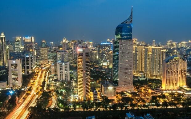 Jakarta city skyline with illuminated skyscrapers at night showing Jakarta architecture