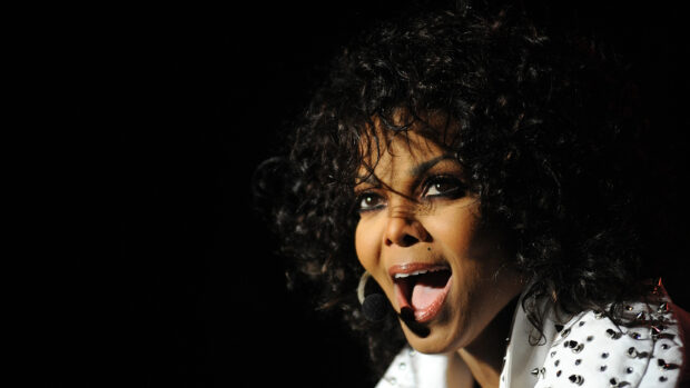 Close up of Janet Jackson singing passionately during live performance