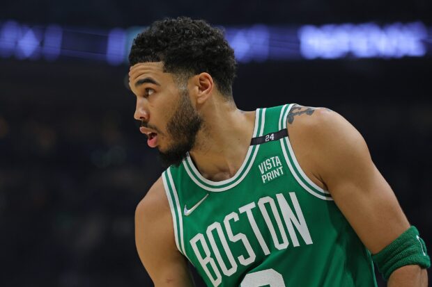 Jayson Tatum wearing a Boston Celtics jersey during a basketball game