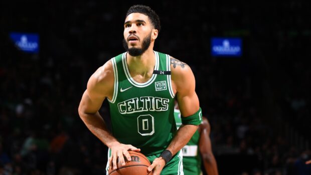 Jayson Tatum in Celtics uniform preparing to take a free throw during a basketball game