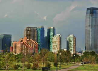 Jersey City skyline with modern buildings and green park landscape