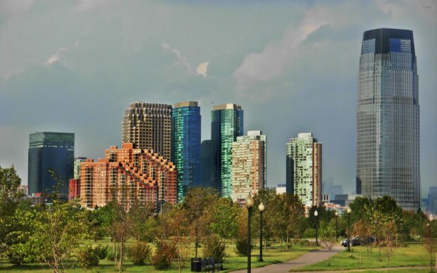 Jersey City skyline with modern buildings and green park landscape