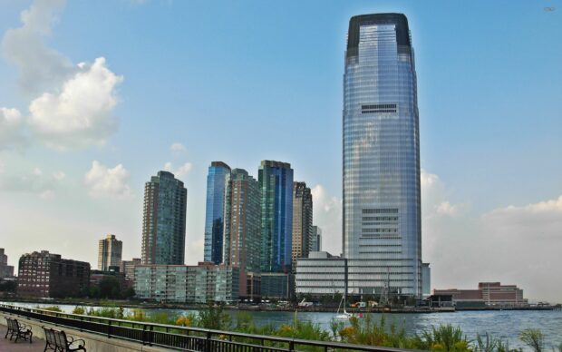 Jersey City skyline with tall buildings along the waterfront on a clear day