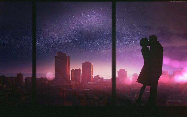 A romantic kiss between a couple silhouette with a starry night sky in the cityscape background