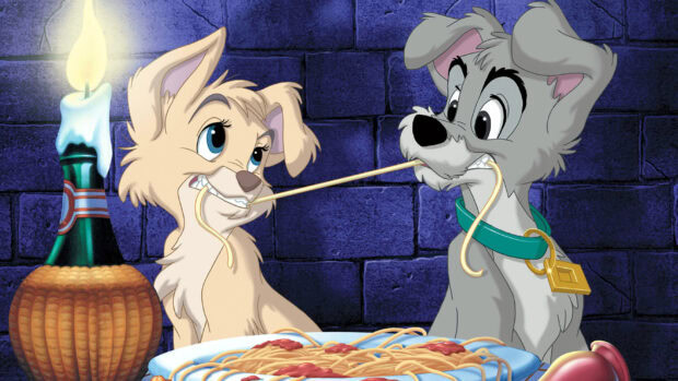 Lady and the Tramp characters sharing a spaghetti strand in a romantic dinner scene