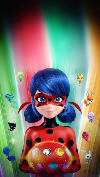 Ladybug holding a glowing orb surrounded by colorful kwami characters in a vibrant scene