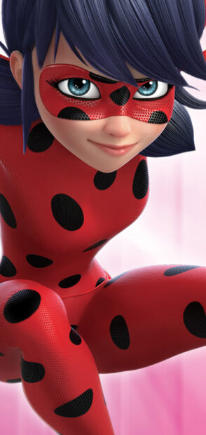 A close up of Ladybug character with blue eyes and a red suit with black dots