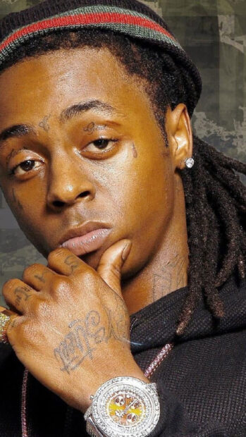 Lil Wayne showing his tattoos and wearing a luxury watch on his hand