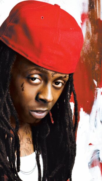 Lil Wayne with dreadlocks and a red cap close up portrait