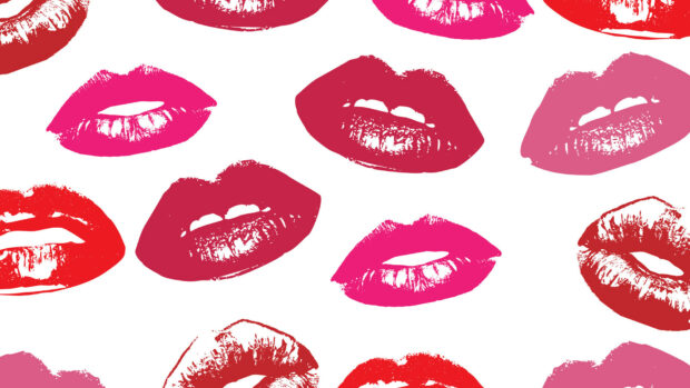 Colorful lips in various lipstick shades creating a vibrant pattern with lipstick shapes