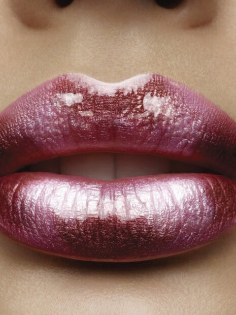 Close up of lips with shiny lipstick showing texture and color