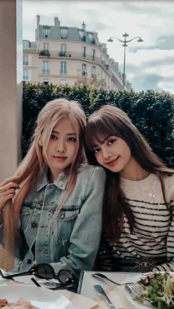 Lisa and Ros&eacute; smiling together in a casual setting with Lisa Blackpink