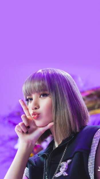 Lisa with a blonde bob hairstyle making a finger gun pose in a purple setting