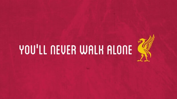 Youll Never Walk Alone phrase with Liverpool Fc emblem on red background