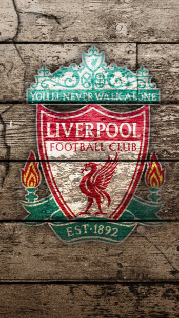 Liverpool Fc emblem on wooden background showing football club pride