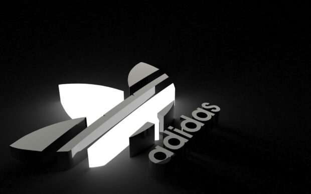 3D Adidas logo shining brightly in dark background with Adidas text