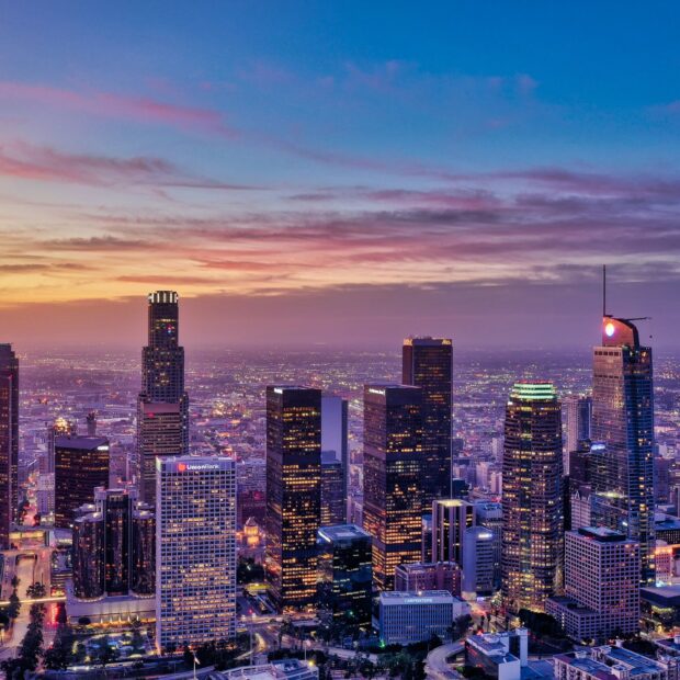 Los Angeles cityscape showcasing vibrant skyline during sunset with skyscrapers and colorful sky