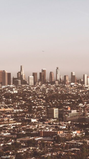 Los Angeles city skyline with tall buildings and urban landscape in warm light