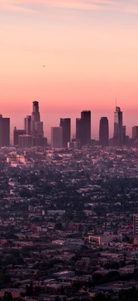 Los Angeles skyline at sunset with clear sky and urban buildings in view