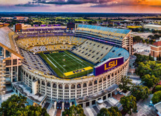 Aerial view of Louisiana Tiger Stadium with LSU field and surrounding areas at sunset