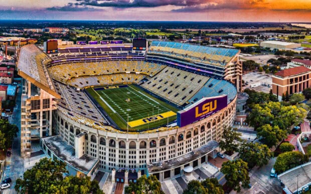 Aerial view of Louisiana Tiger Stadium with LSU field and surrounding areas at sunset