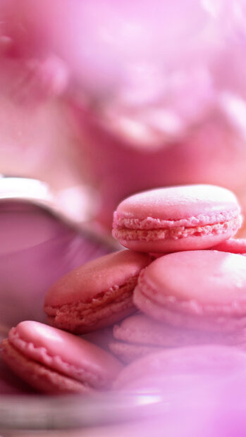 Pink macaron close up with soft focus and creamy texture in pastel tones