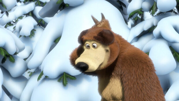 The bear character from Masha and the bear stands in the snowy forest with green pine branches visible