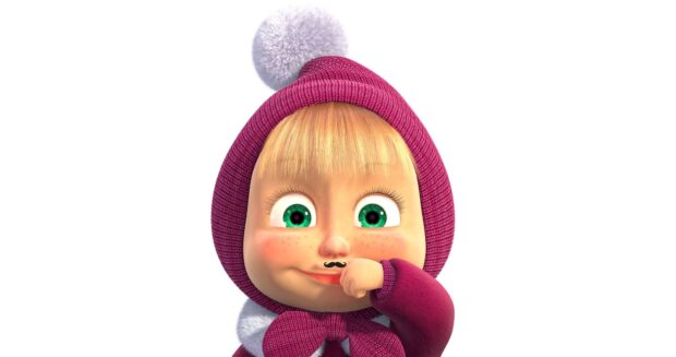 Masha with green eyes dressed in a purple winter hat and sweater
