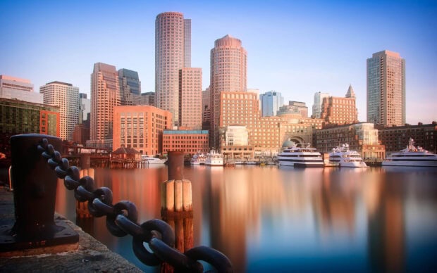 Boston skyline with waterfront and chain barrier in Massachusetts cityscape