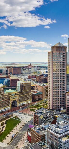 Aerial view of Massachusetts cityscape featuring distinctive round tower and urban park