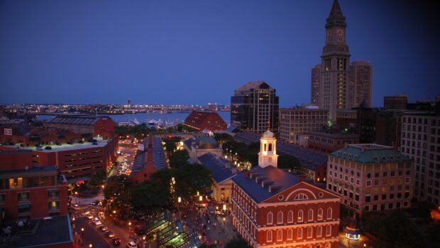 Evening cityscape of Massachusetts historical district with clock tower and vibrant street lights
