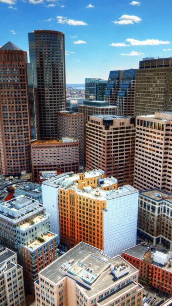 Aerial view of Massachusetts downtown with tall buildings and clear blue sky