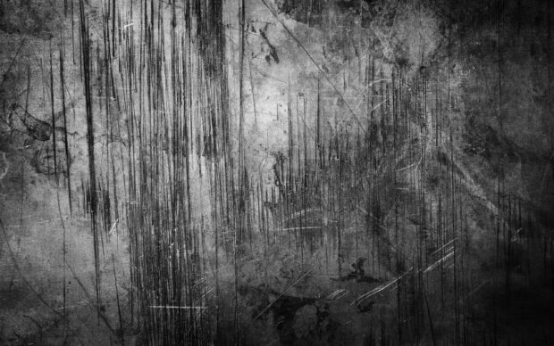 Scratched metal texture surface with dark and light shades showing rough metal texture