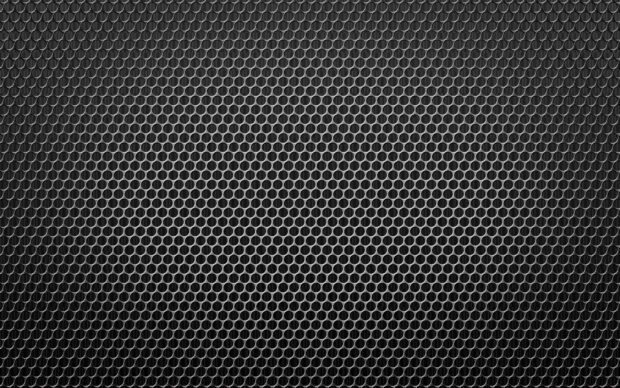 Close up of metal honeycomb texture with dark industrial design