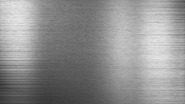 Brushed steel texture with fine horizontal lines and subtle reflections across the surface