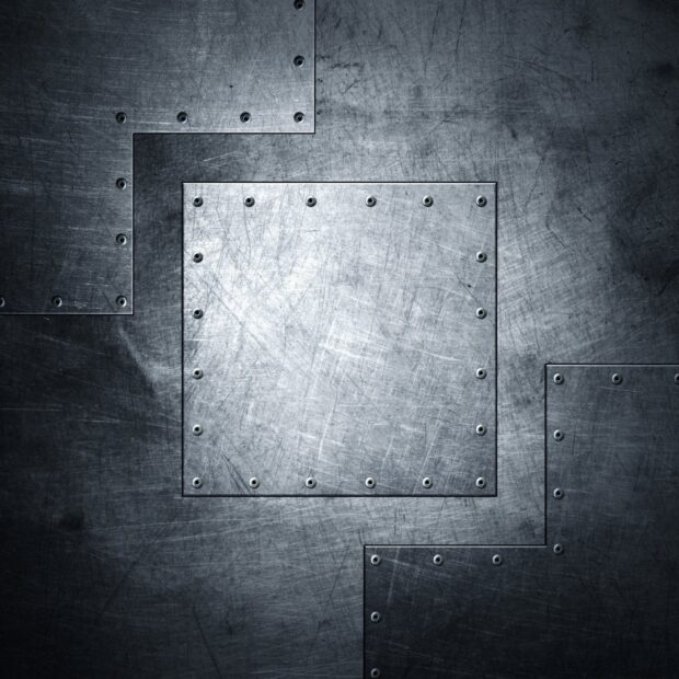 Scratched metal texture with riveted steel plates forming a geometric pattern