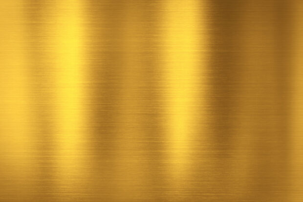 Brushed gold metal texture with vertical light reflections and smooth surface